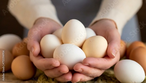 Chicken eggs in hands. Selective focus.