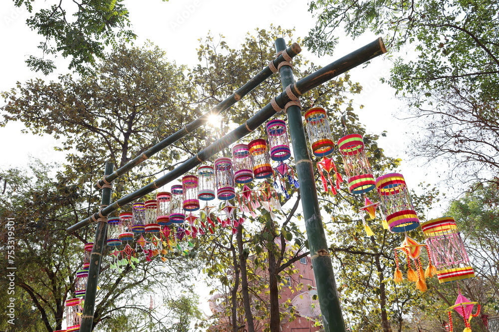 Lanterns hung on a bamboo arch. Colorful rice is a symbol that represents good fortune and protects against evil in important ceremonies of the Isan people in Thailand. Select focus