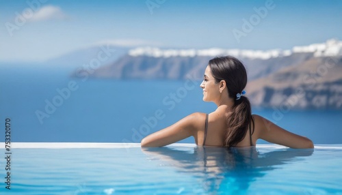 Beautiful women on vacation at Santorini relaxing in swimming pool looking out over ocean © adobedesigner