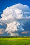 Dramatic Portrait of towering Cumulonimbus Clouds Against a Deep Blue Sky - The Power and Majesty of Nature Unveiled