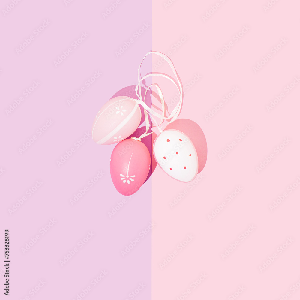 Beautiful pink and white Easter eggs on pastel background. Minimal Holiday concept. Copy space. Flat lay, Top view. Greeting card.