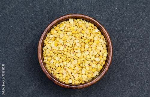 Toor dal or arhar dal in a wooden bowl top view  photo