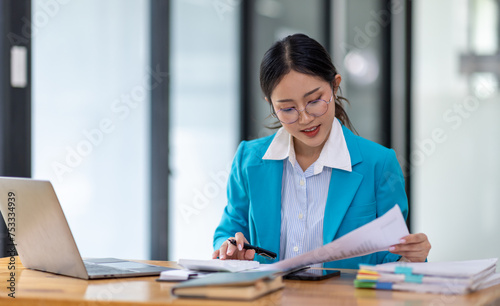 Business Documents  Auditor businesswoman checking searching document legal prepare paperwork or report for analysis TAX time accountant Documents data contract partner deal in workplace office 