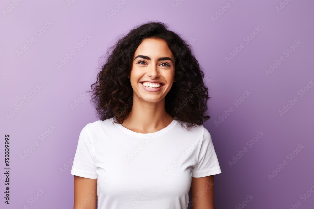 Portrait of happy smiling young woman in white t-shirt, over violet background Portrait of happy smiling young woman in white t-shirt, over violet background