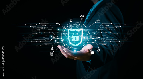 Fototapeta Naklejka Na Ścianę i Meble -  Businessman holding shield protect icon in hand on binary background, Global networking connection background, Network security and data protection and safe your data concept, cybersecurity