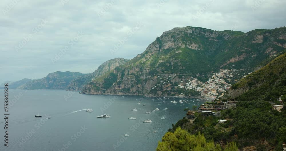 Panoramic movement of the bay of Positano, with the city in the background. Many boats on the bay - Amalfi Coast, Naples - Italy Panoramic movement of the bay of Positano, with the city in the background. Many boats on the bay - Amalfi Coast, Naples - Italy