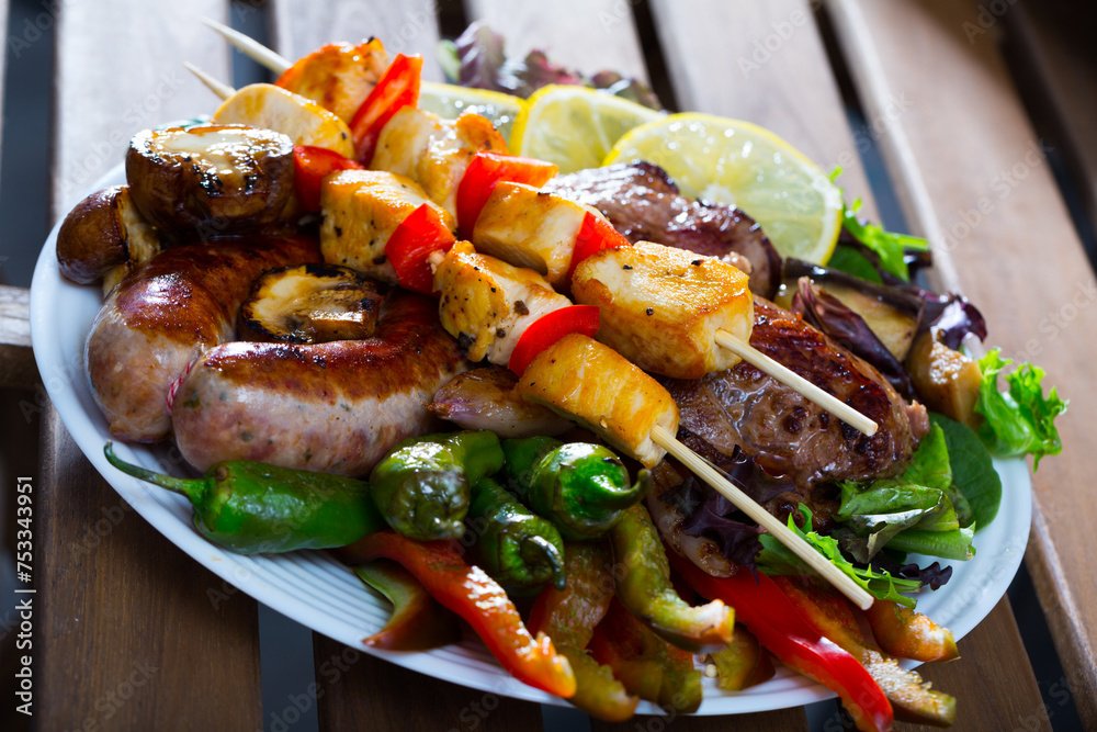 Naklejka premium Traditional Bulgarian dish Meshans skara – mixed grilled meat, sausages and vegetables
