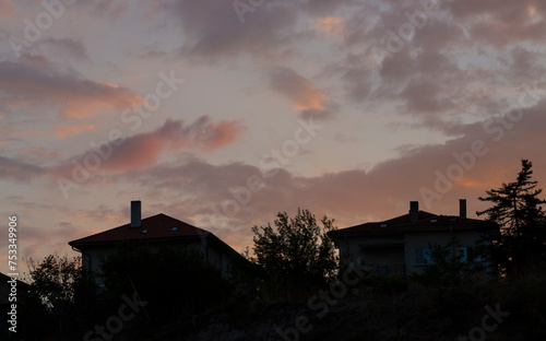 Colorful sunset over the Bulgarian town of Balchik. Cumulus clouds in a red-purple scale.