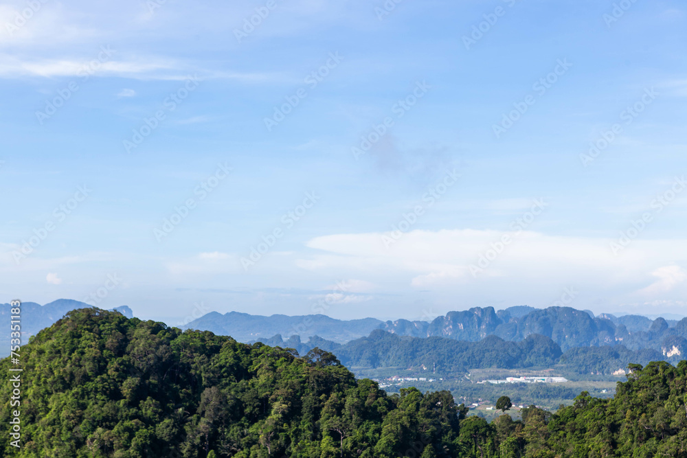 Thailand, Krabi province landscape. View from Tiger Cave Temple (Wat Tham Suea). Blue sky and green jungles limestone mountains at the bottom.