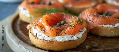 Breakfast choice consisting of salmon, cream cheese, dill, capers on a plain bagel.