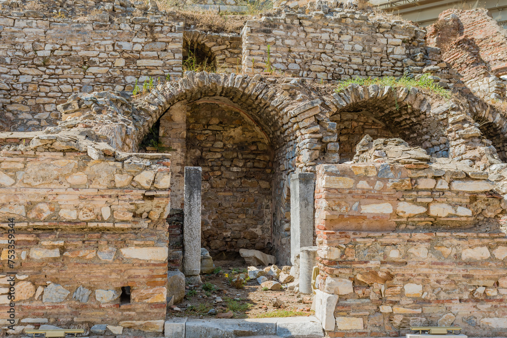 Ruined ancient arches in a historical site showing old brickwork and structure, in Ephesus, Turkiye