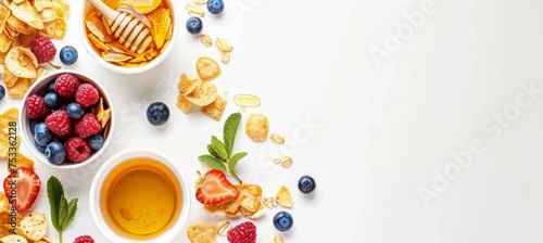 Delicious american breakfast  cornflakes with berries and honey on white background with copy space