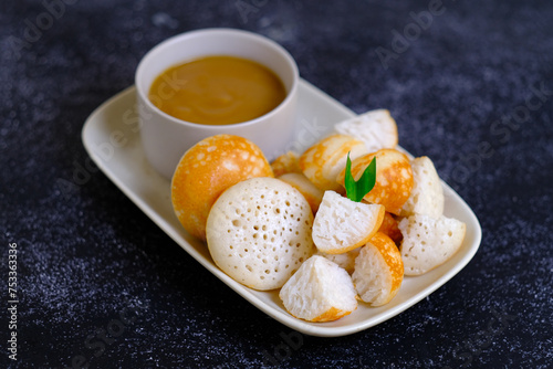 serabi, indonesian pancake with sauce photo