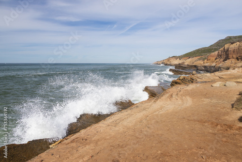 Waves breaking on cliffs, San Diego, California
