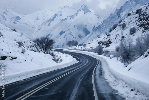 Empty highways wind down snowy mountain slopes