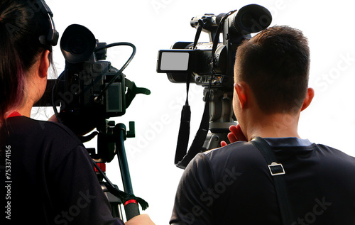  Camera operators are shooting news at location.