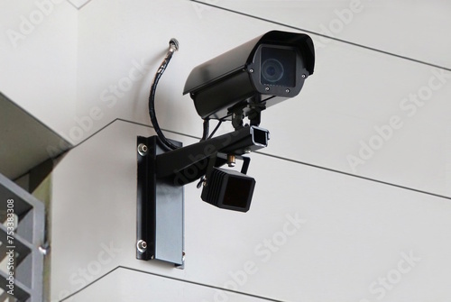 CCTV surveillance camera monitoring surrounding area. © noraismail