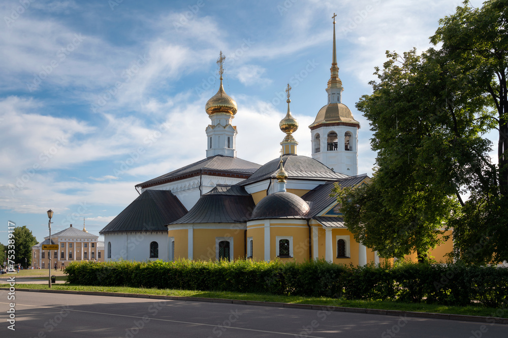 View of the Kazan Church (Church of the Kazan Icon of the Mother of God) and the Resurrection Church on the main square of the city on a sunny summer day, Suzdal, Vladimir region, Russia