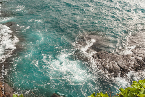 waves crashing on a rock in the ocean blue water storm