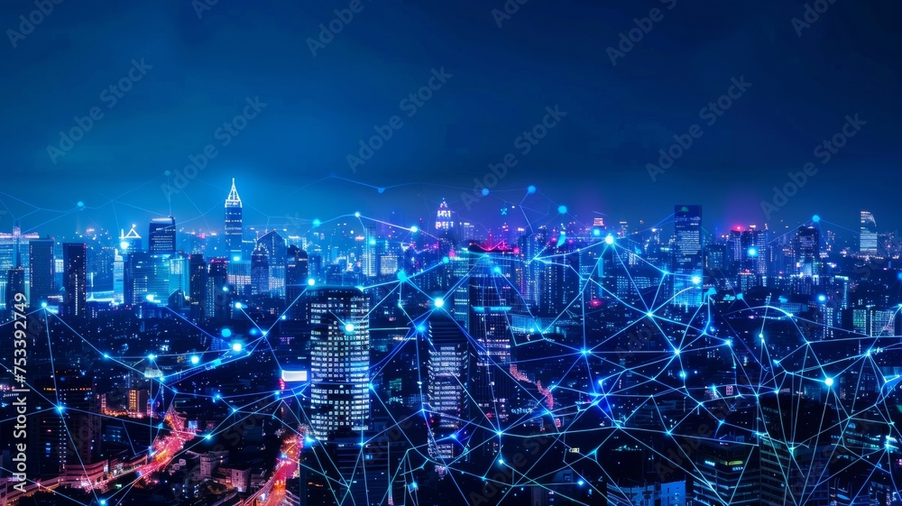 A modern city illuminated at night, featuring wireless network connections and connectivity technology