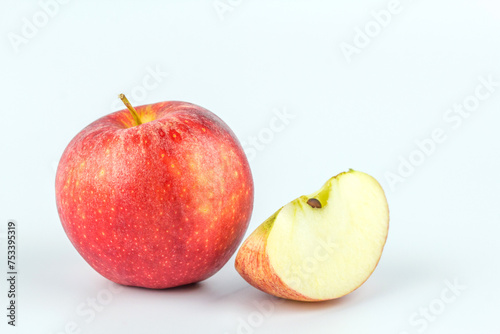 Sliced red apple on white background.