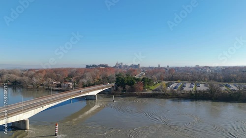 Aerial orbiting shot of cars driving over a bridge to Villeneuve lès Avignon photo