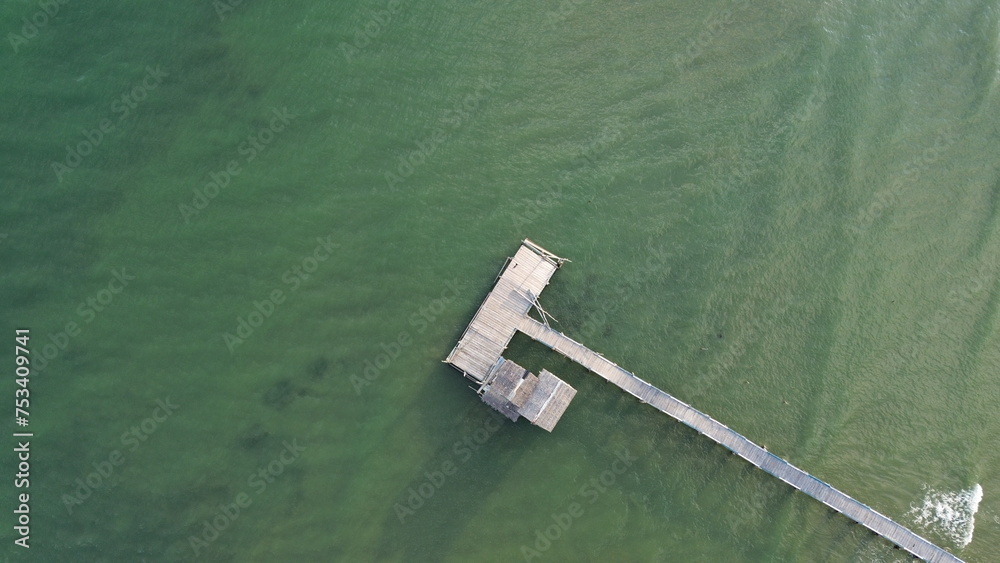 Aerial view of wooden pier in the sea