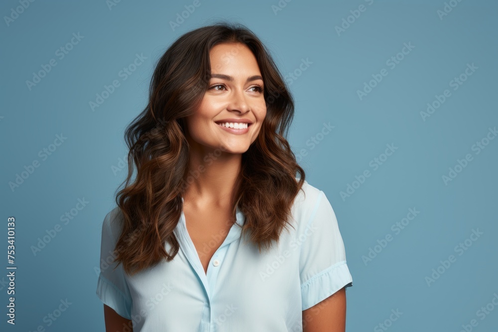 Portrait of happy smiling young business woman, over blue background. Portrait of happy smiling young business woman, over blue background.