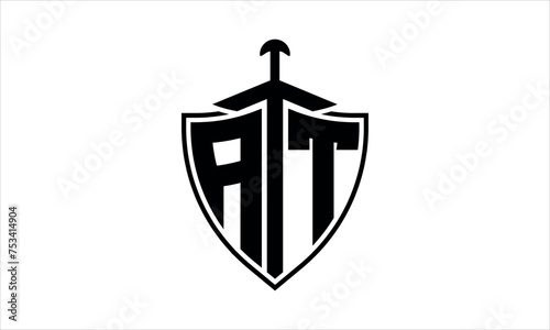 AT initial letter shield icon gaming logo design vector template. batman logo, sports logo, monogram, polygon, war game, symbol, playing logo, abstract, fighting, typography, icon, minimal, knife logo