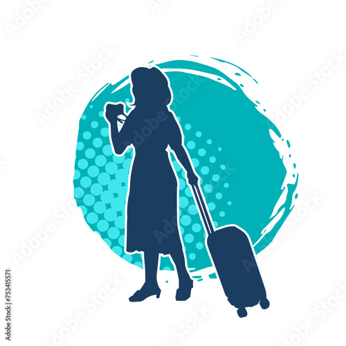 Silhouette of a slim fashionable female model carrying travelling luggage while walking
