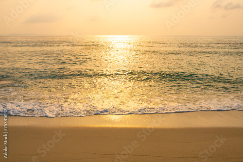 Sea view for summer vacation concept Nature of the summer beach and sea with soft sunlight. hitting the sand The sea sparkles against the sunset sky. 