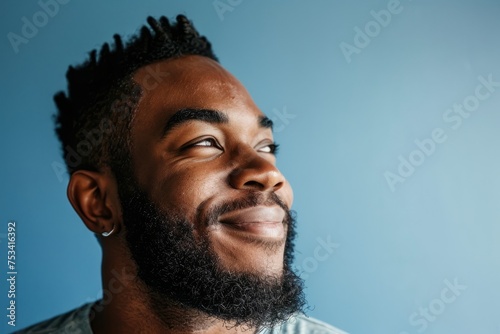 Portrait of a handsome african american man on blue background