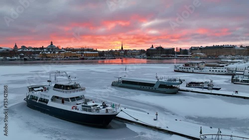 Vibrant Sunset Over Frozen Ladugårdslandsviken: Central Stockholm Drone Flight photo
