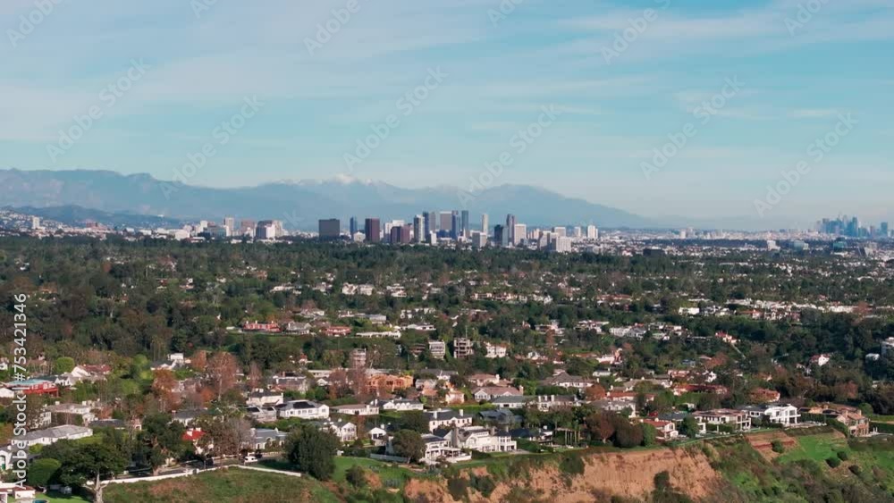 Panning to the left drone shot of hollywood and los angeles from a distance Panning to the left drone shot of hollywood and los angeles from a distance