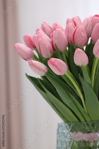 Bouquet of beautiful pink tulips on blurred background, closeup