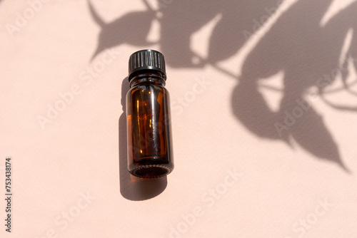 A bottle essential oil is sitting on a table