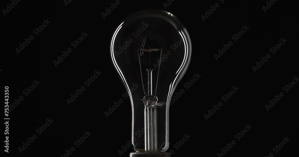Full Shot Of Clear Light Bulb Dimming To Bright Level And Going Off Again