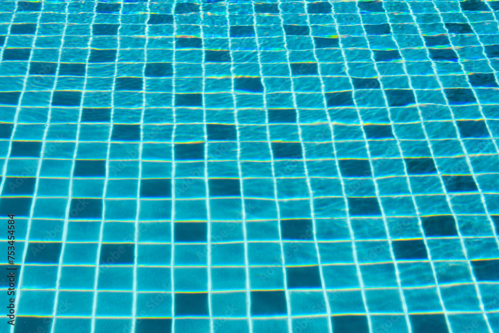 Swimming pool with blue water waves