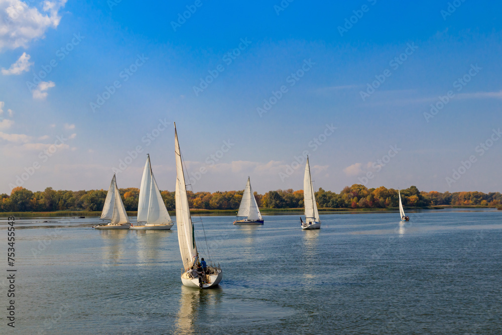 Obraz premium Yachts at sailing regatta on the Dnieper river in Kremenchug, Ukraine