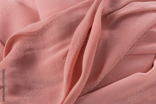 Soft pink fabric shaped as female genital organs, vulva and labia photo