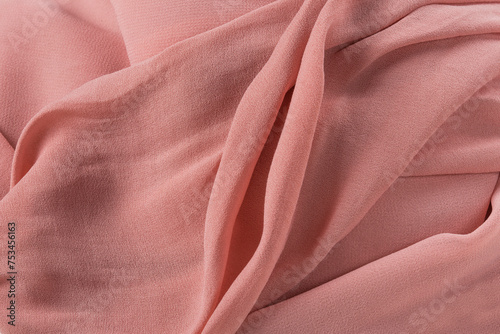 Soft pink fabric shaped as female genital organs, vulva and labia