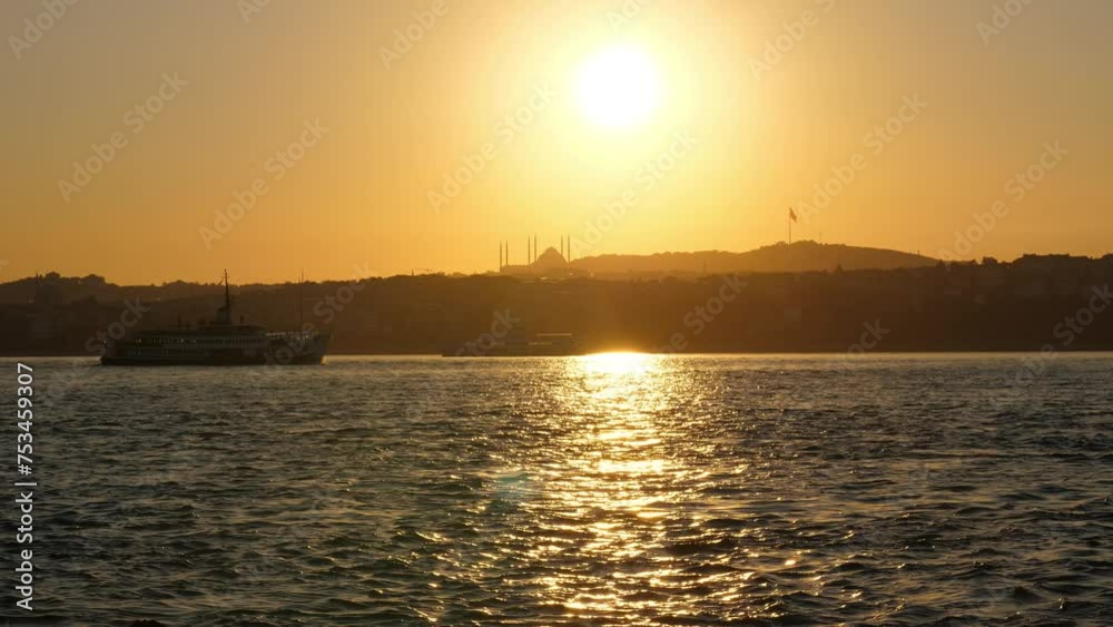 On tranquil morning, ferry glides along shimmering Bosphorus waters, reflecting bright sunlight. Solitary vessel traverses towards Asian side, offering serene view of Istanbul cityscape On tranquil morning, ferry glides along shimmering Bosphorus waters, reflecting bright sunlight. Solitary vessel traverses towards Asian side, offering serene view of Istanbul cityscape