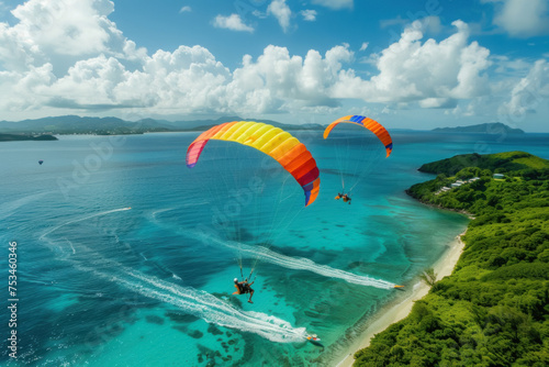 Aerial View of Paragliders Soaring Over Tropical Island with Crystal Clear Blue Waters © KirKam