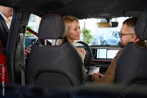 Lady looks at her husband while driving © Viacheslav Yakobchuk