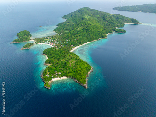 Drone view of tropical beach with white sand and corals. Alad Island. Romblon, Philippines.