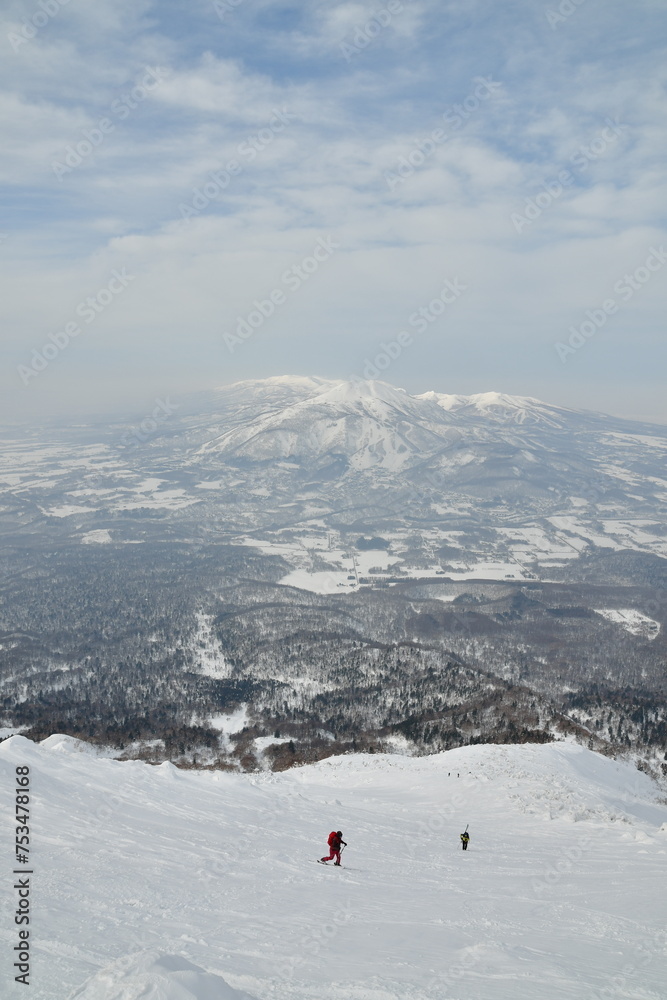Mt Yotei ski touring ascent on sunny winter day Hokkaido Japan