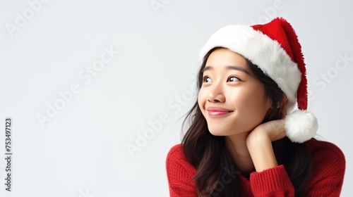 Smiling Asian woman wearing a Santa hat  Fictional Character Created By Generated AI.