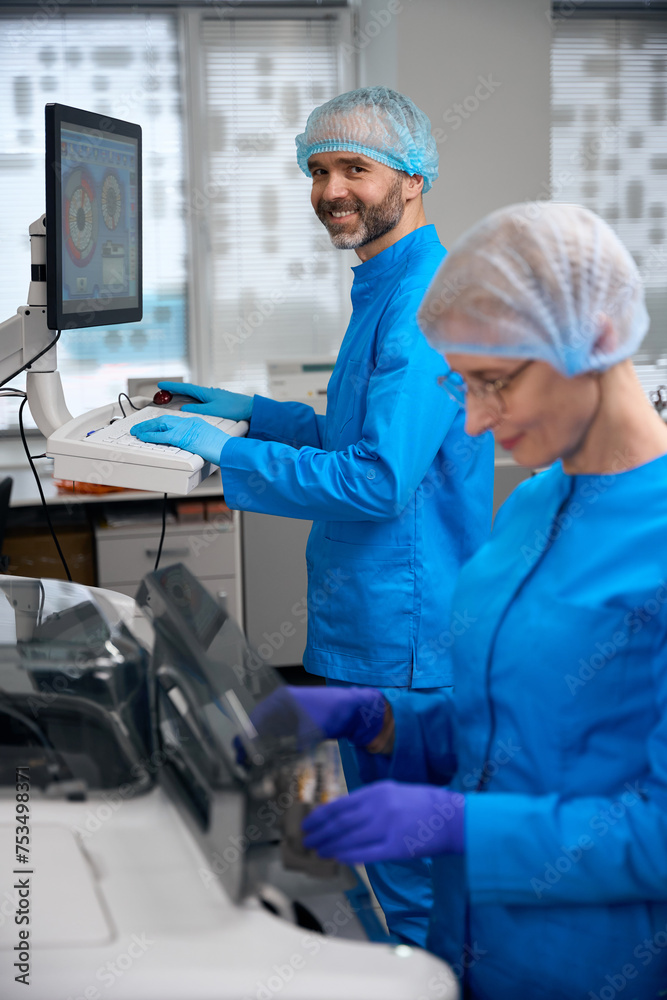 Laboratory assistants use high-tech equipment in their work Laboratory assistants use high-tech equipment in their work