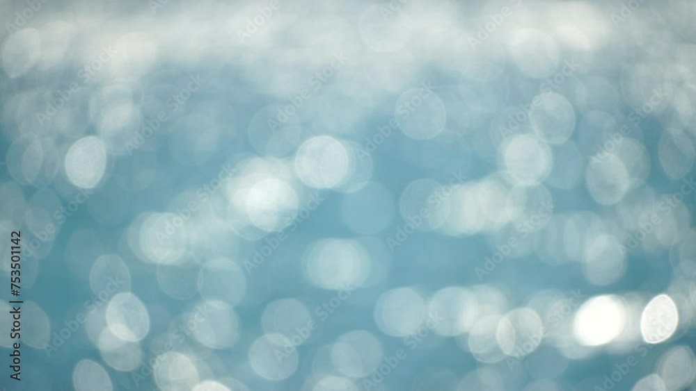 Abstract sea summer ocean sunset nature background. Small waves on golden water surface in motion blur with golden bokeh lights from sun. Holiday, vacation and recreation. Weather and climate change. Abstract sea summer ocean sunset nature background. Small waves on golden water surface in motion blur with golden bokeh lights from sun. Holiday, vacation and recreation. Weather and climate change.