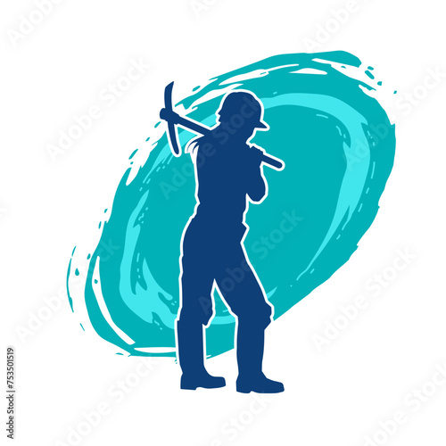 Silhouette of a woman in worker costume carrying pick axe tool in action pose. Silhouette of a female miner in action pose with pick axe tool.